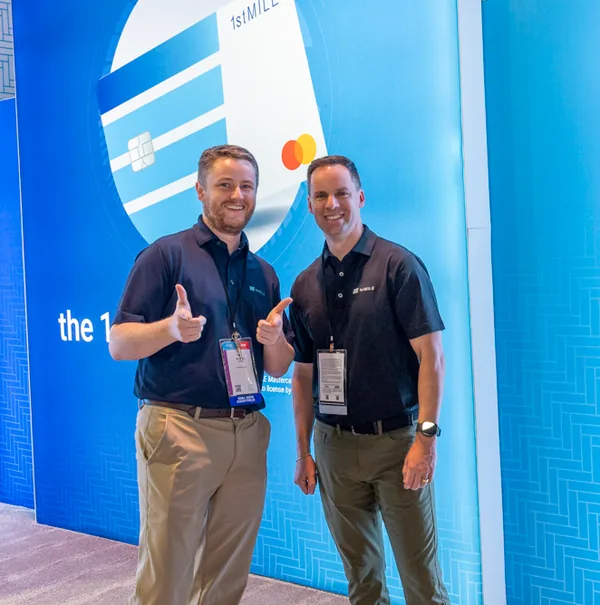 Two 1stMILE team members at an industry event